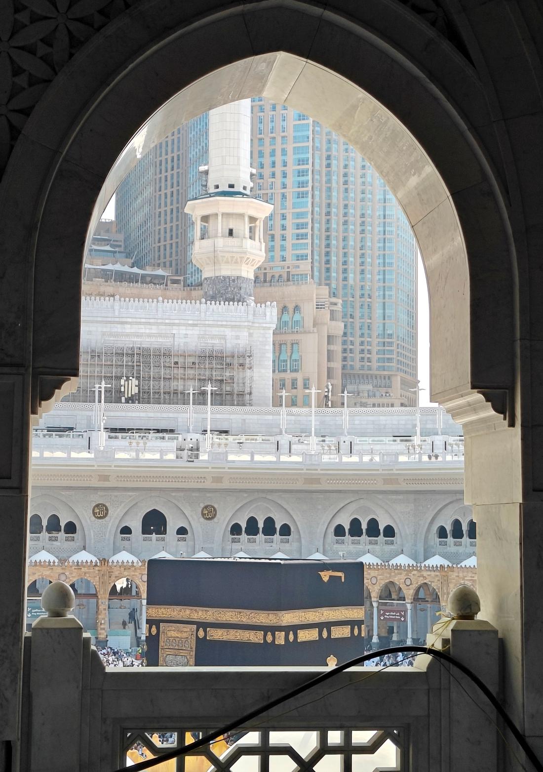 Masjid al-Haram seen through an arch